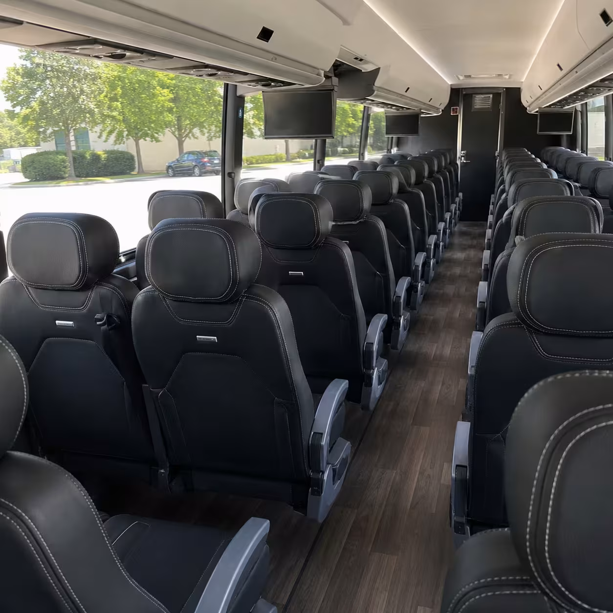 charter bus rentals from clinton township to little caesars arena